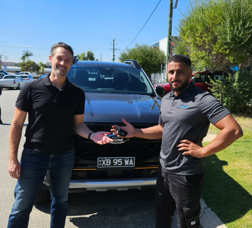 Sell My Car Pro buyer finalising a car sale with a Perth customer
