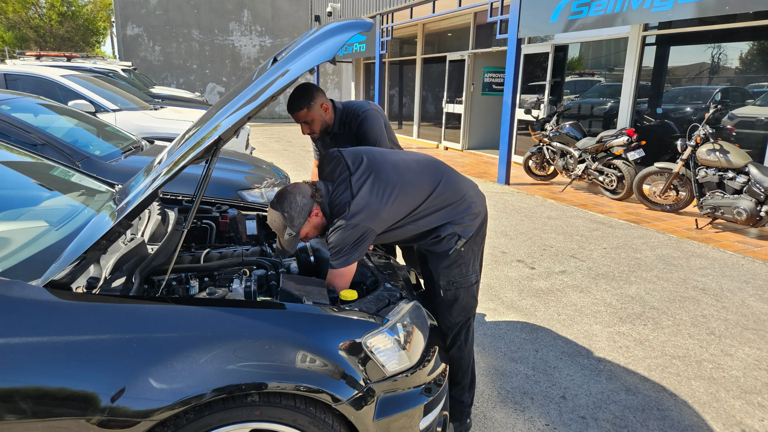 Sell My Car Pro – Purchase Inspection 08 Sell My Car Pro buyer comparing a trade-in offer with a customer