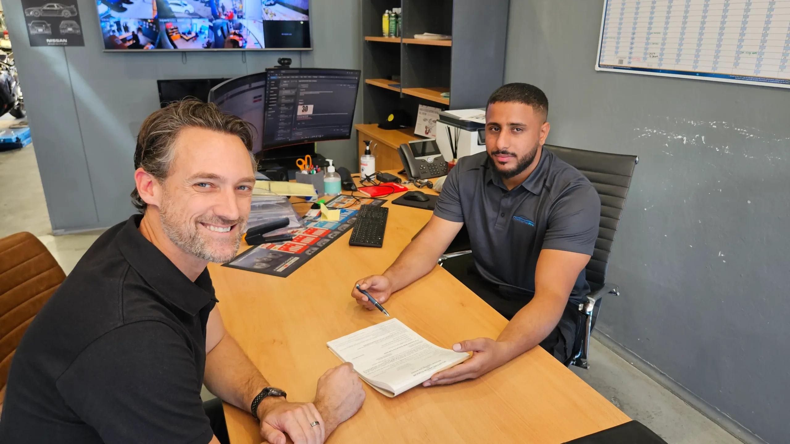 Sell My Car Pro buyer completing a 4WD sale with a customer