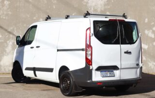 2018 Ford Transit Custom 02 2018 Ford Transit Custom 290S van rear side view with roof racks