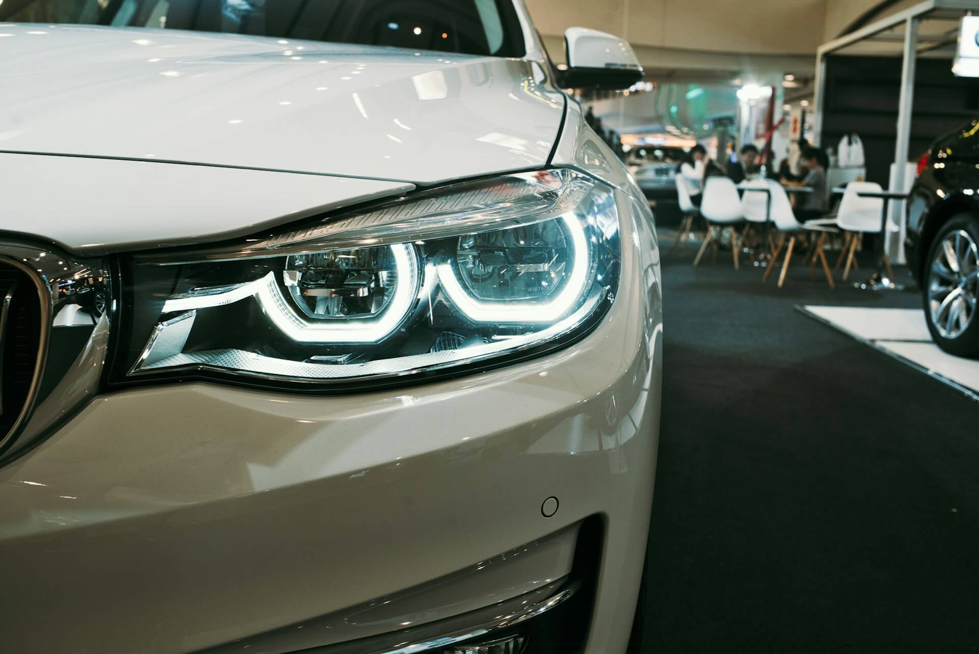 white car in a new car dealership