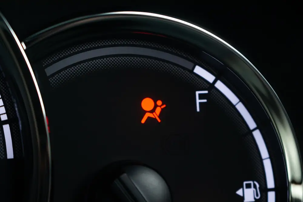 Airbag (SRS) warning light illuminated on a car dashboard